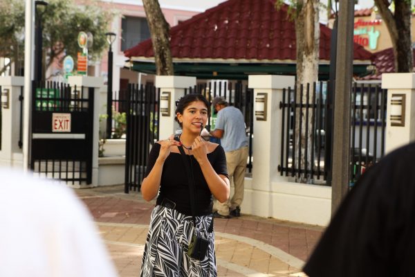 Caro the Tour Guide providing a tour on the history of Little Havana to cleanup participants